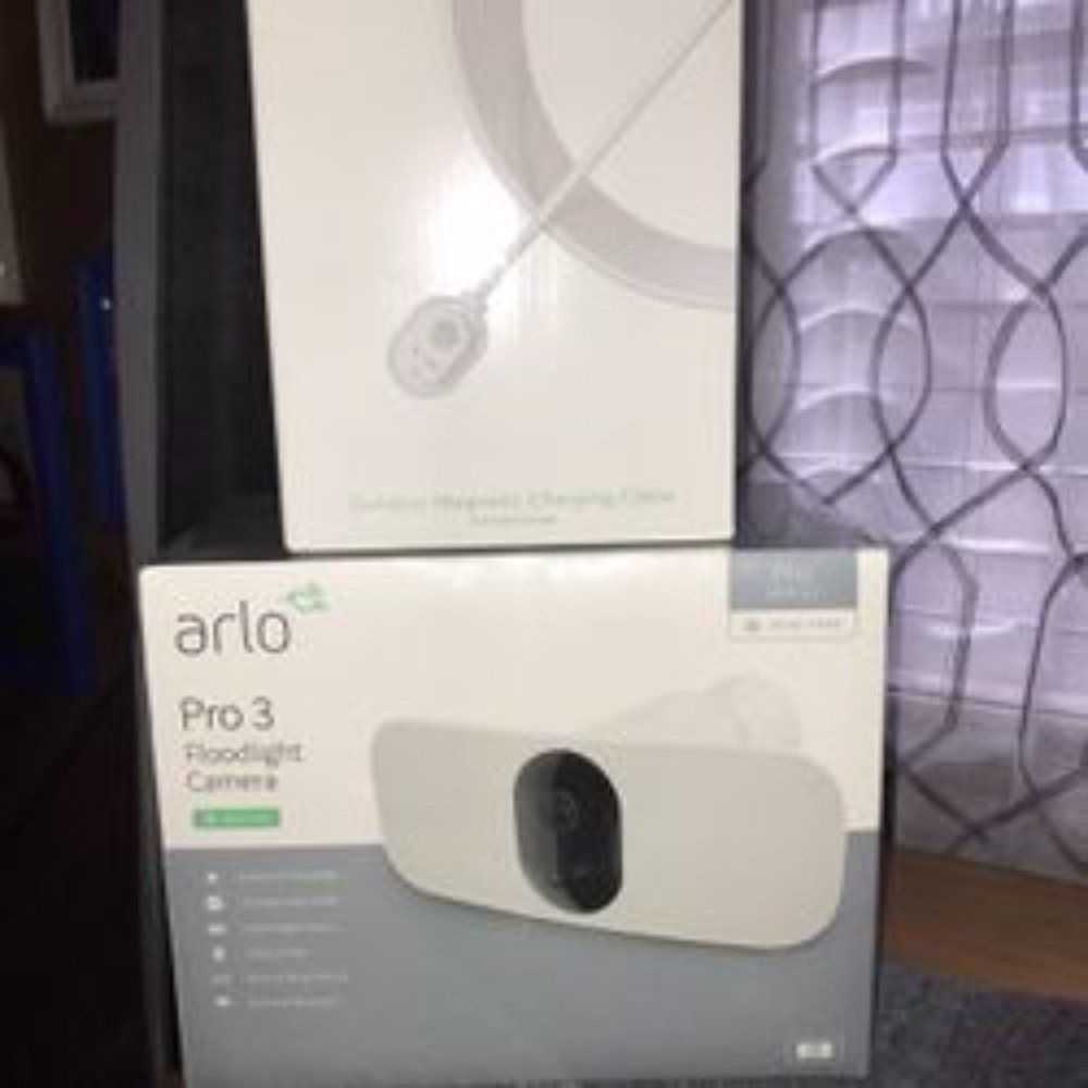 ARLO Floodlight Camera with outdoor charging cable